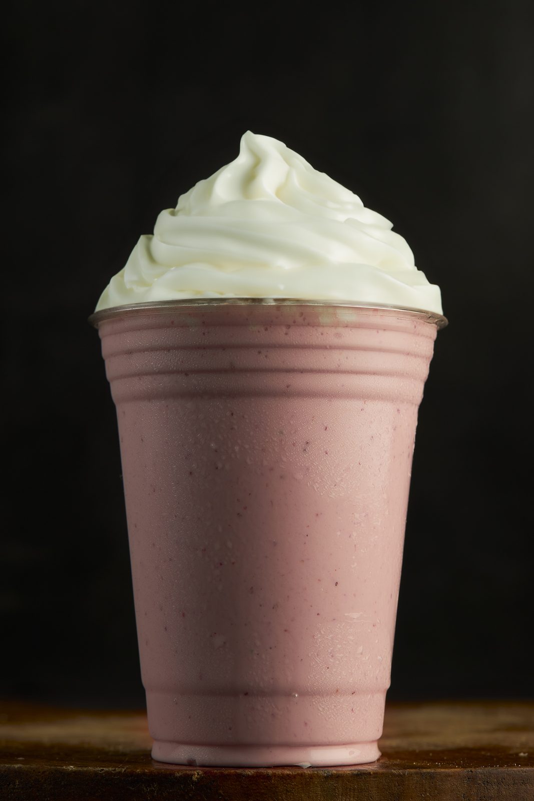 Strawberry milkshake topped with whipped cream